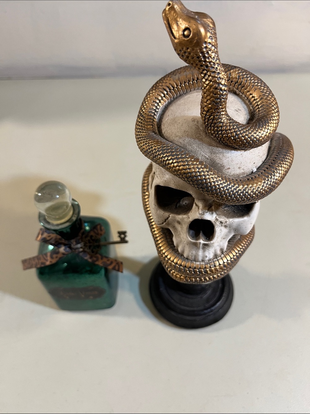 Decorative Skull Statue with Wrapped Gold Snake - White and Gold Accent